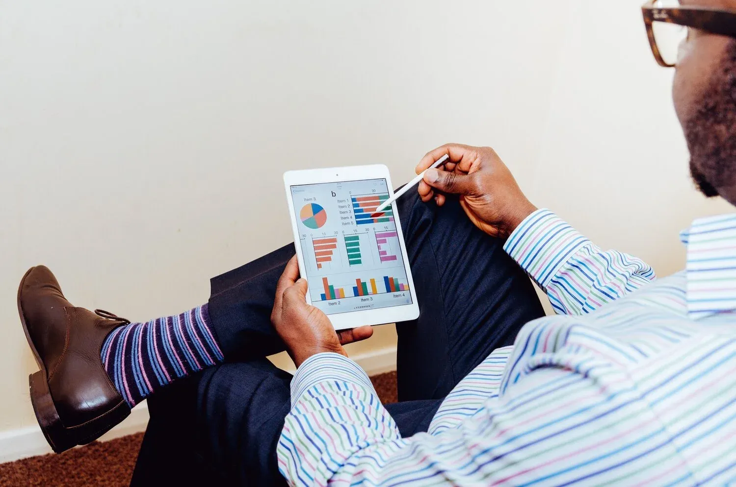 Professional reviewing account data on a laptop